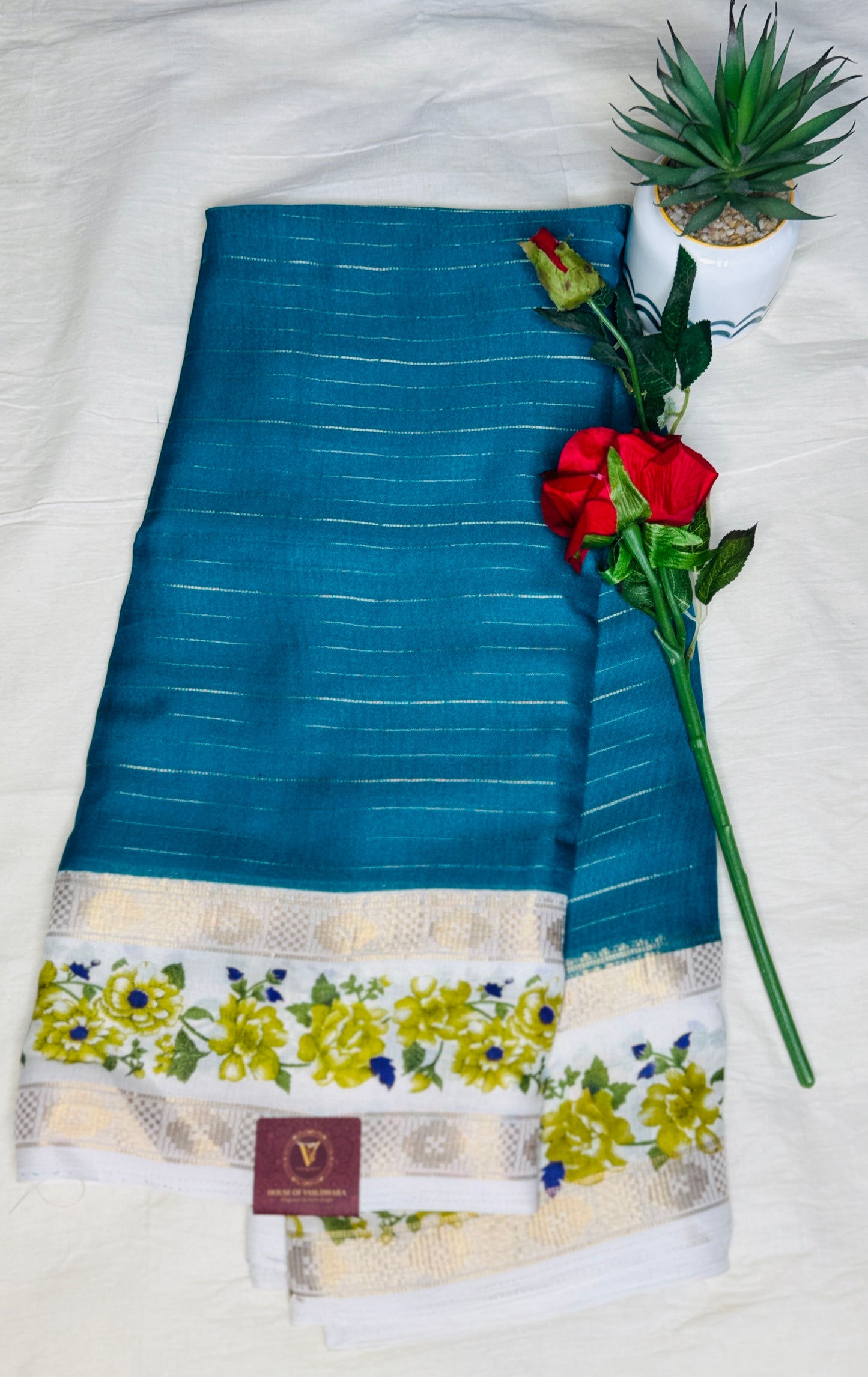 Turquise blue Georgette with Floral Bentex border