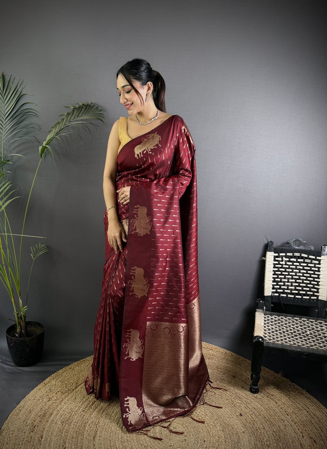 Wine-maroon Pichwai motifs Litchi Silk saree