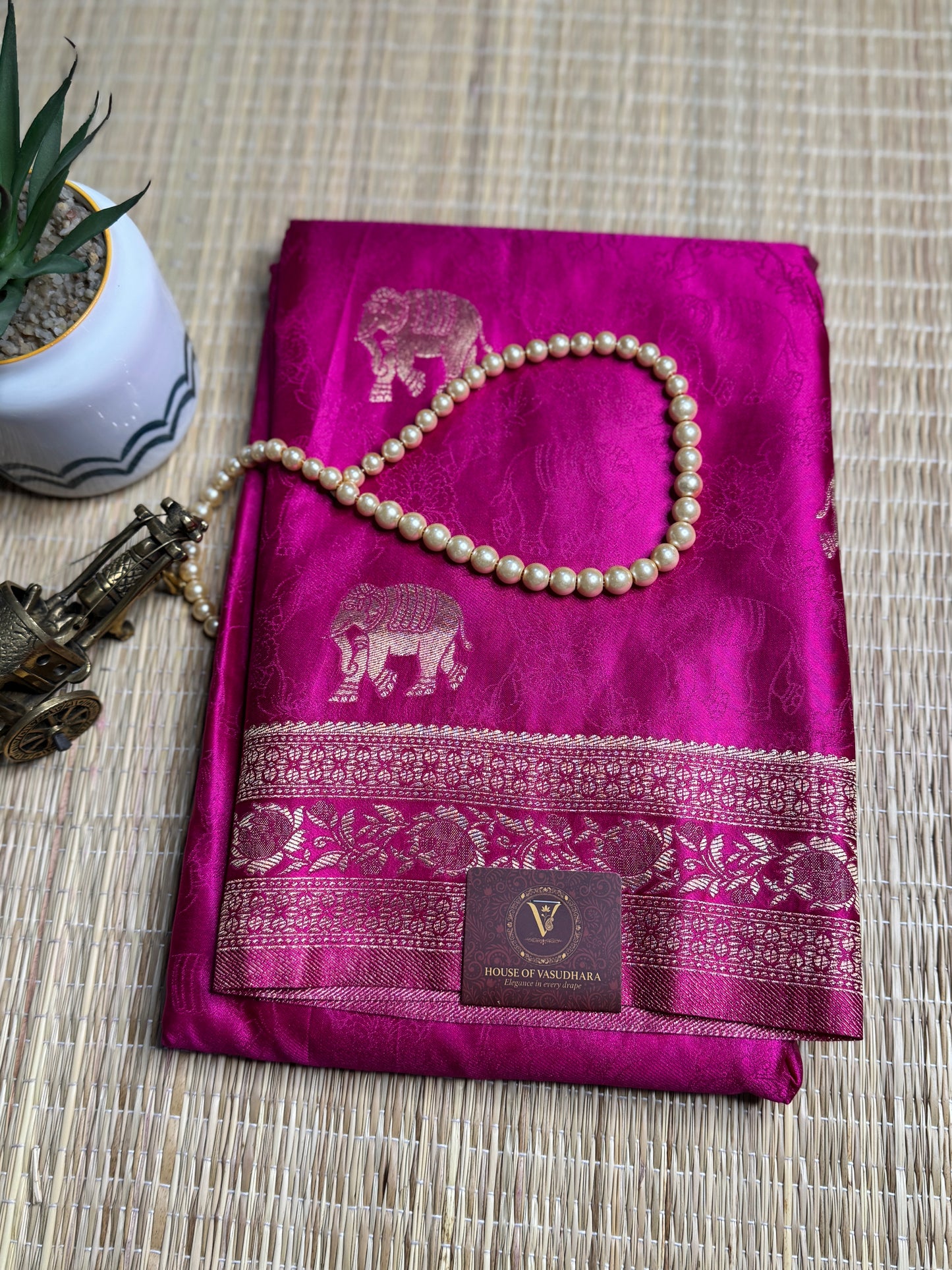 Rani Pink Satin silk saree with elephant motifs