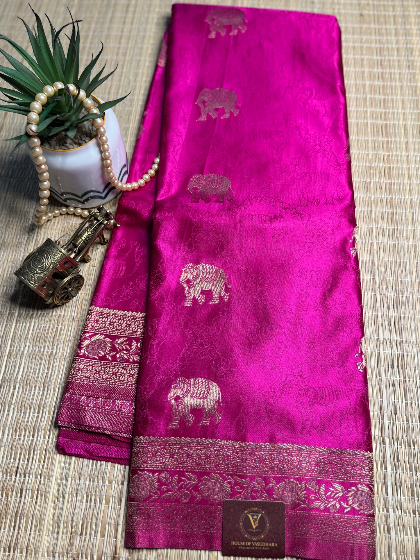 Rani Pink Satin silk saree with elephant motifs