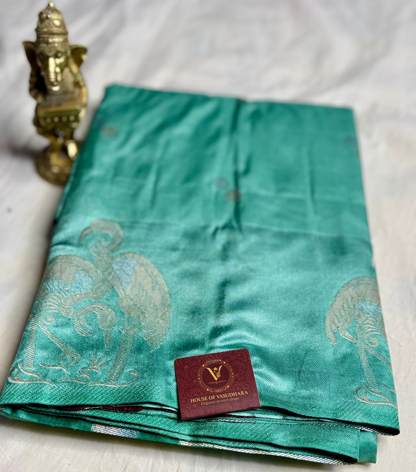 Teal green Satin silk saree with Flamingo Motifs