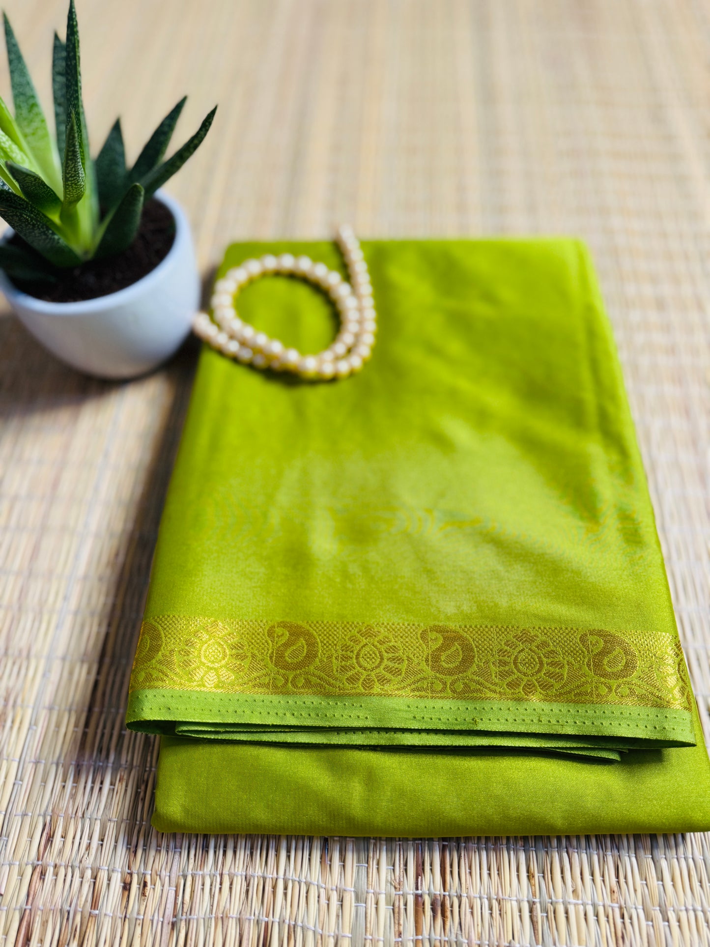 Parrot Green Semi Crepe Silk Saree with Mango Zari Border