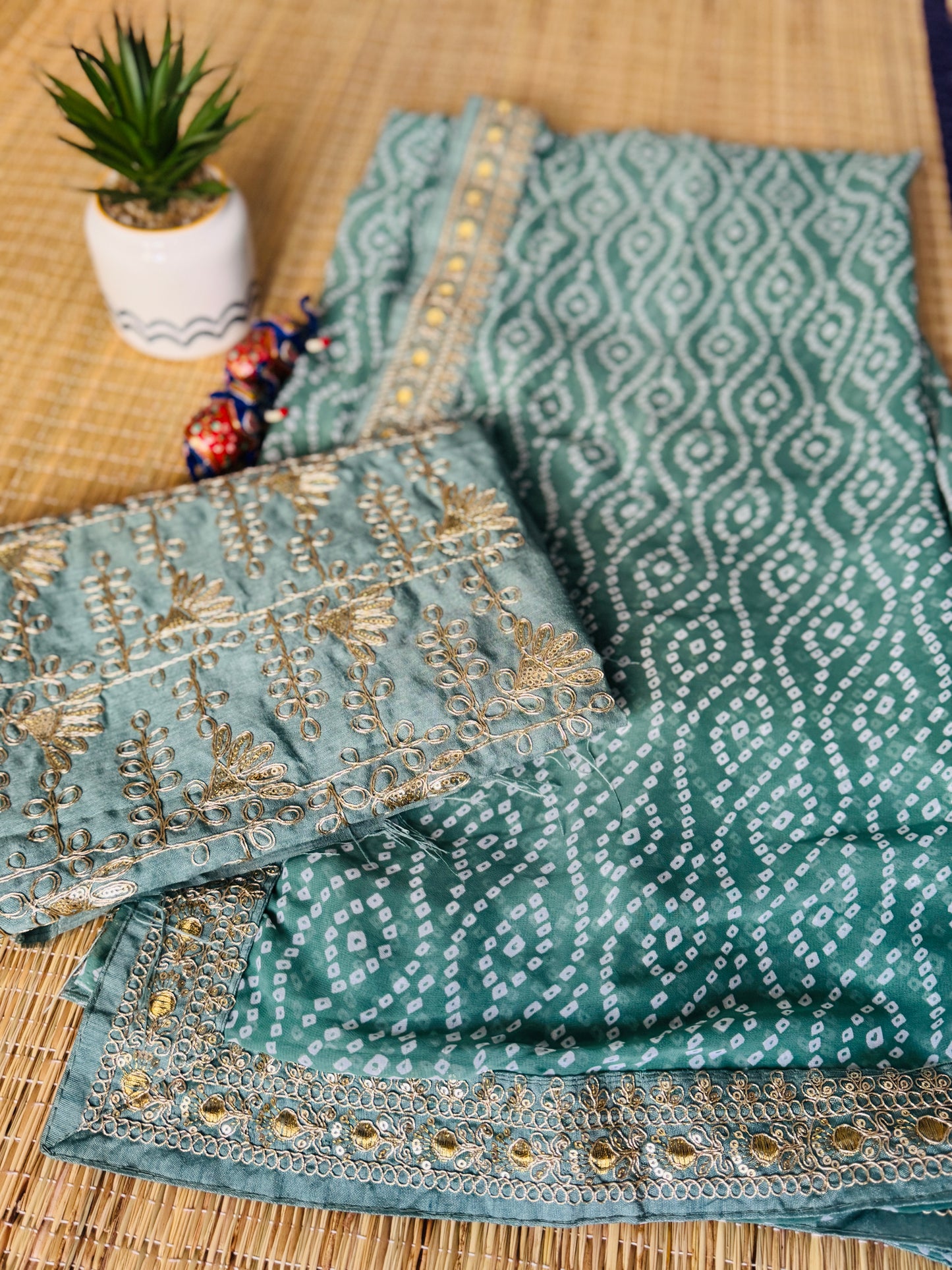 Green georgette saree in bandhini with embellished border