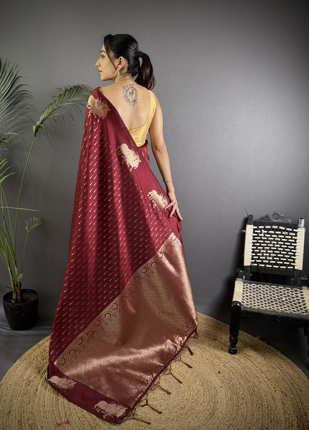 Wine-maroon Pichwai motifs Litchi Silk saree