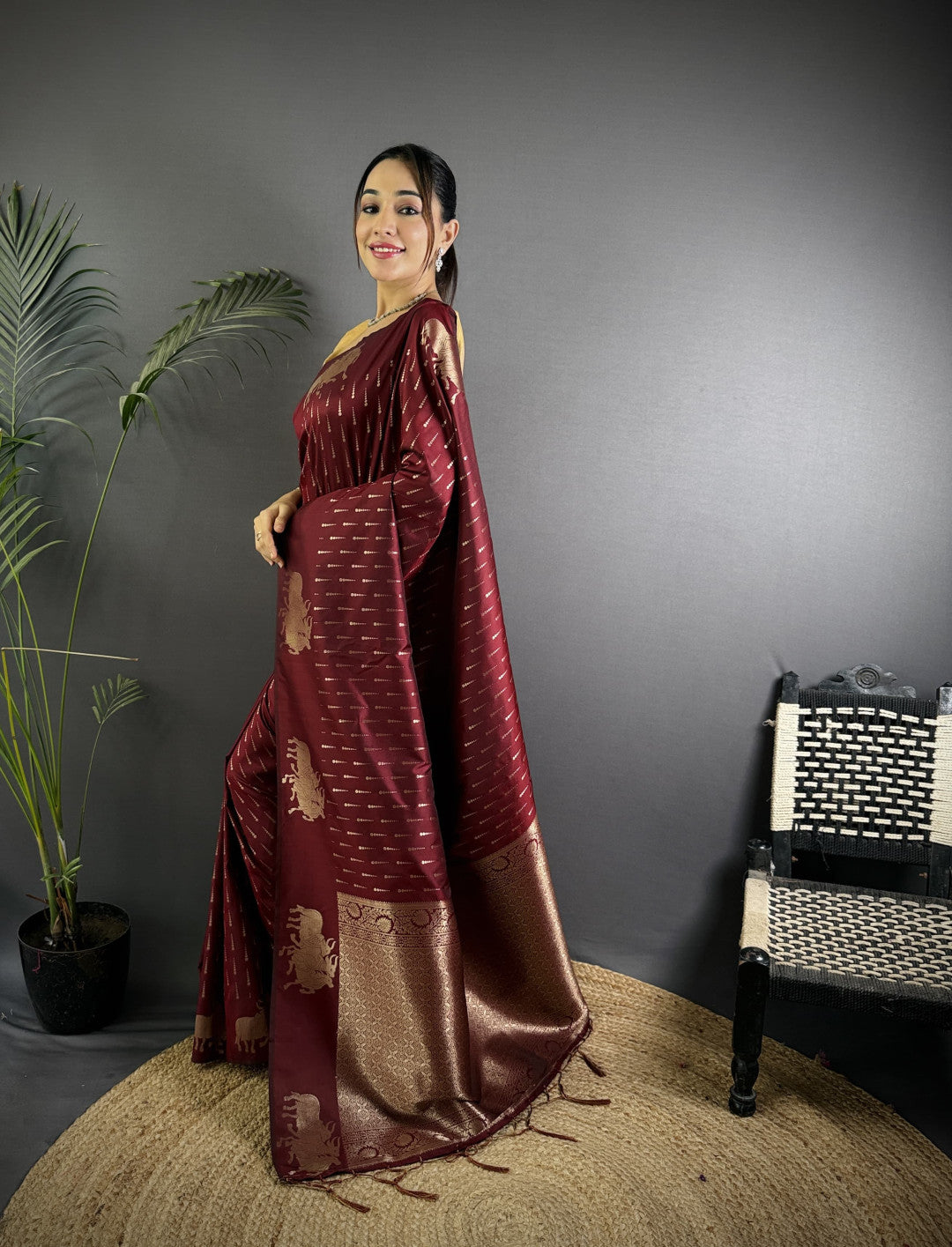 Wine-maroon Pichwai motifs Litchi Silk saree