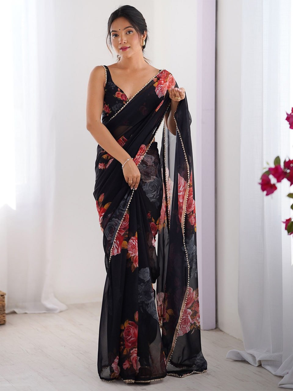 Black georgette saree with floral print and pearl border